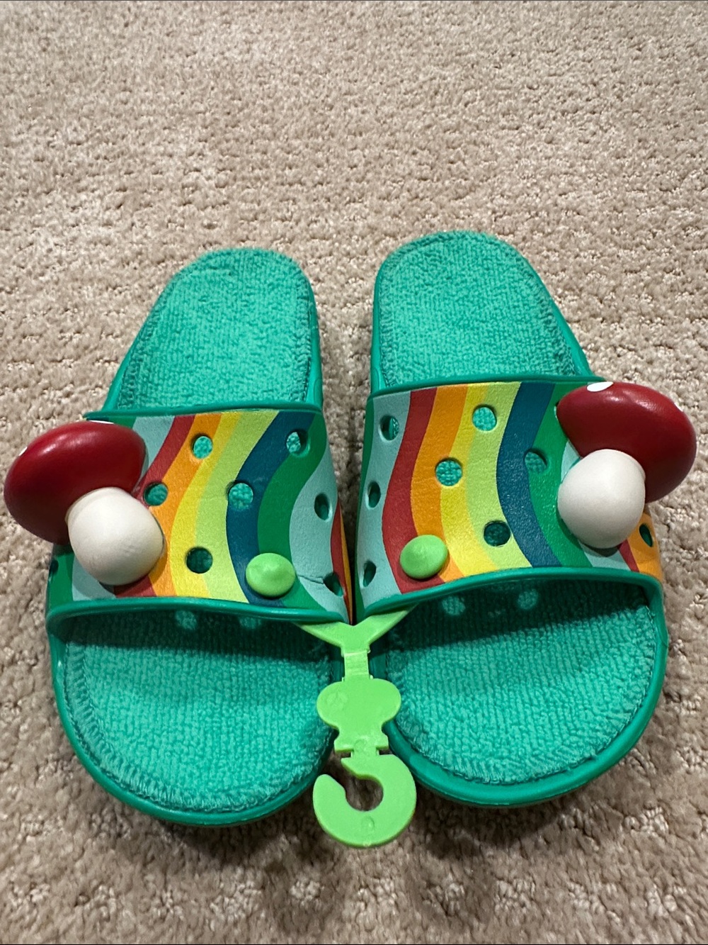 CROCS Teal Slide Sandals with Rainbow Straps and Red Mushroom Charms